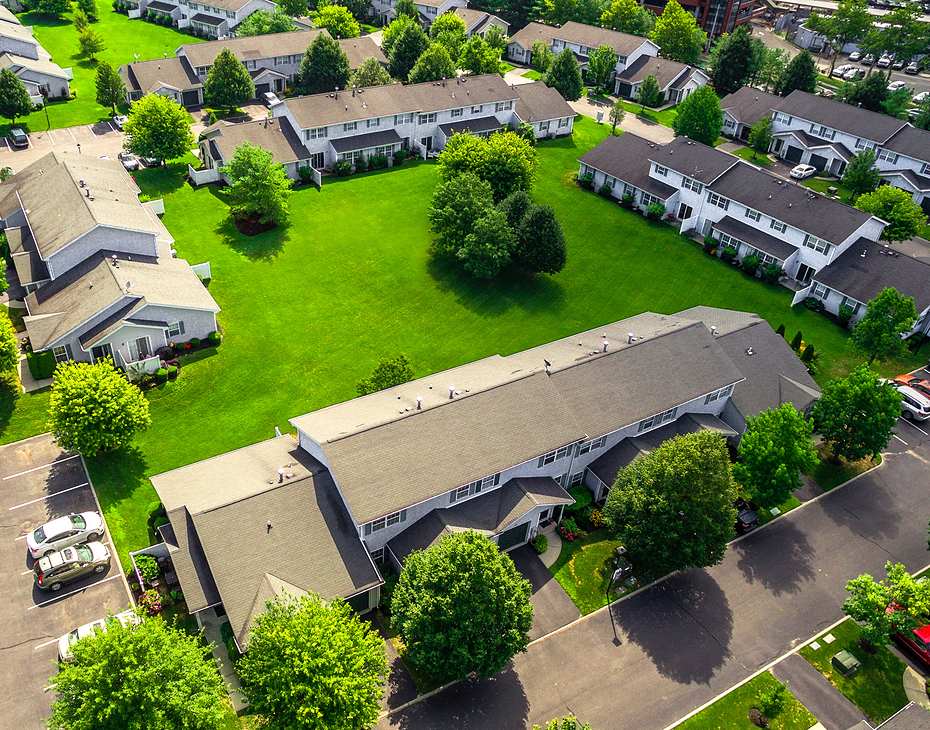 aerial view of community with green grass